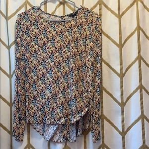 High-low button back floral blouse.